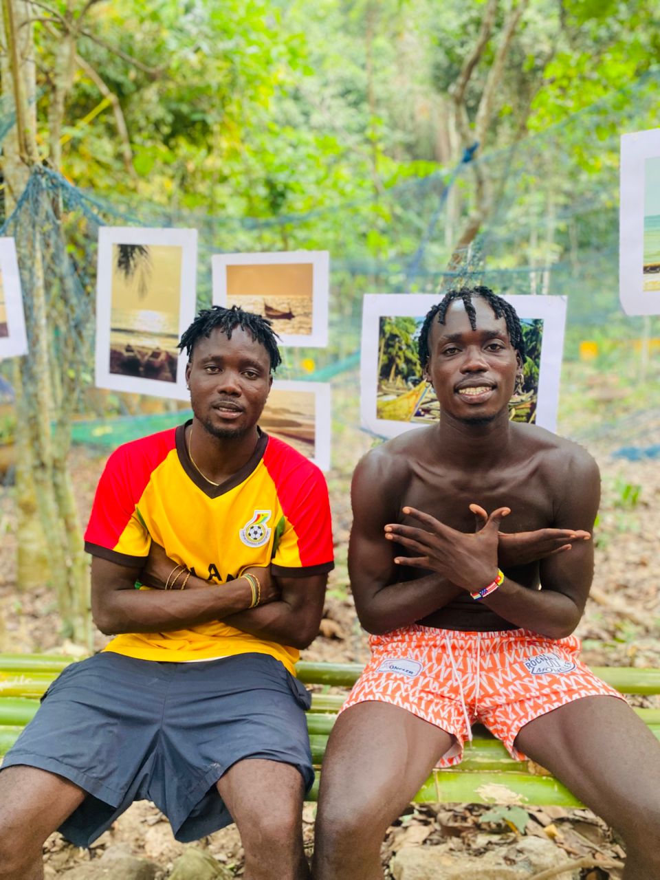 Solomon and Daniel Bentum sitting on a bamboo bench in Kokrobite